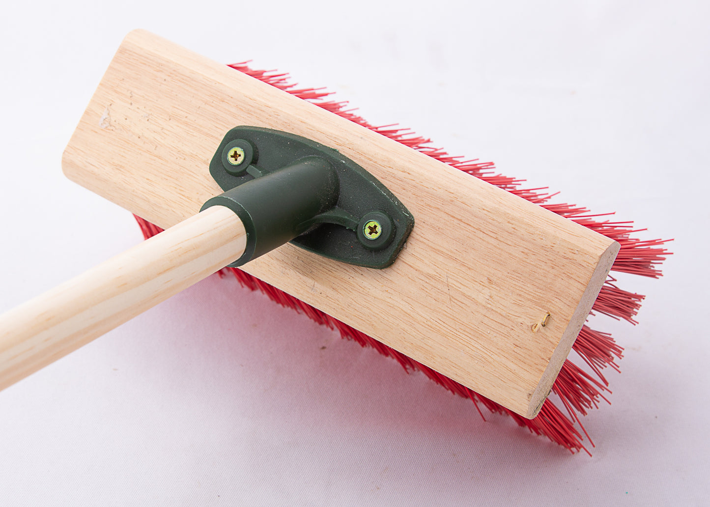 photo showing the wooden stock and threaded connection point of our stiff yard broom
