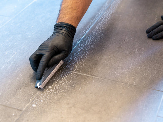 using our v shaped brush for cleaning between indoor floor tiles