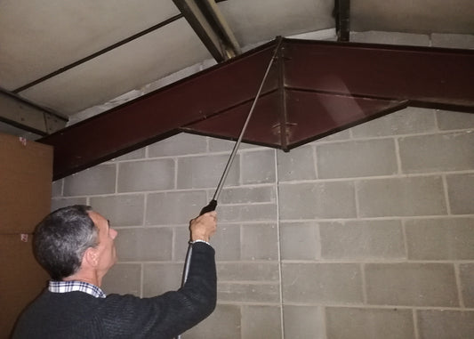 photo showing the 1.5 metre lance extension being used with our powder compressions sprayer