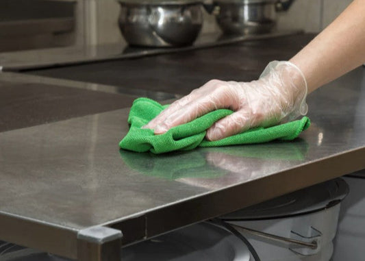 cleaning a stainless steel kitchen surface