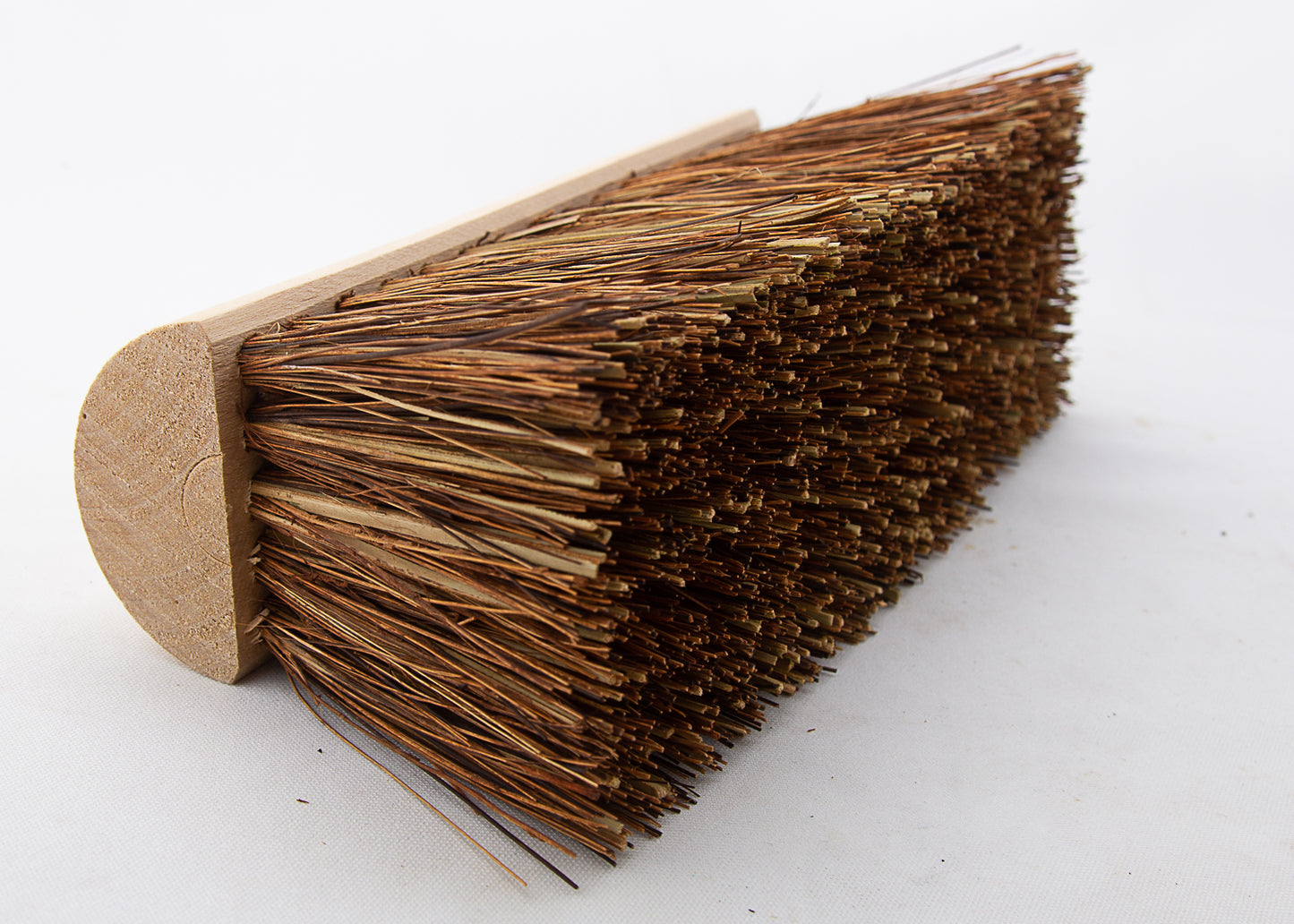 close up photo of our outdoor wooden broom head with natural bristles