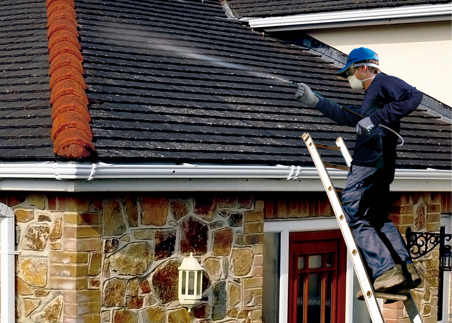 using the atlas to spray a roof with moss killer