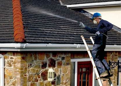 photo showing our pump action sprayer being used to apply moss killing solution to a pitched roof