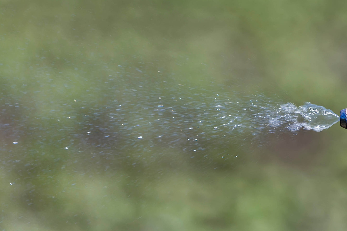 liquid being sprayed showing the spray pattern indicator